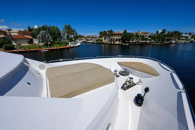 Remy Roo Yacht Photos Pics Luxurious 2014 Westport 112 yacht deck with sun pads, overlooking waterfront homes.