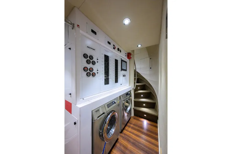 Remy Roo Yacht Photos Pics Laundry room with control panel and staircase on 2014 Westport 112 yacht.