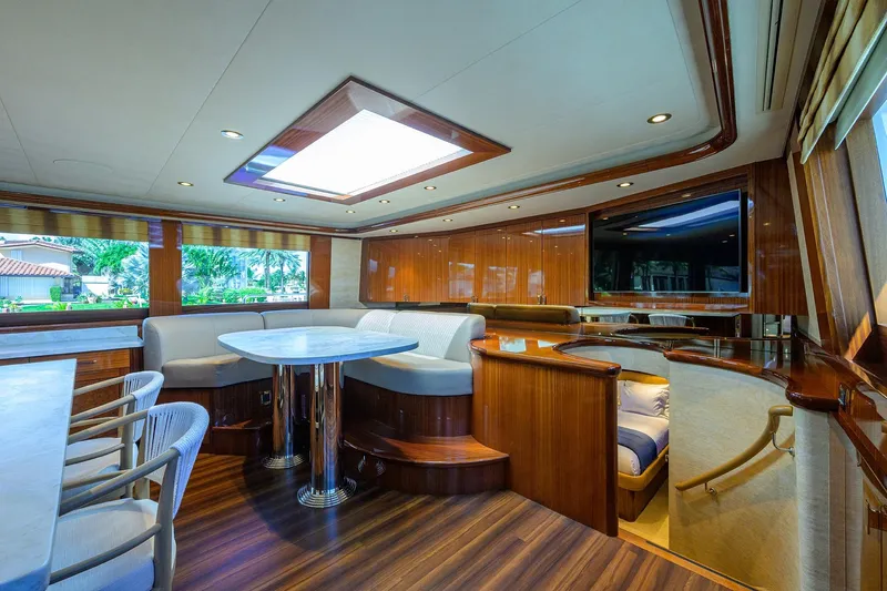 Remy Roo Yacht Photos Pics Luxurious interior of 2014 Westport 112 yacht with elegant wood finishes and modern seating.