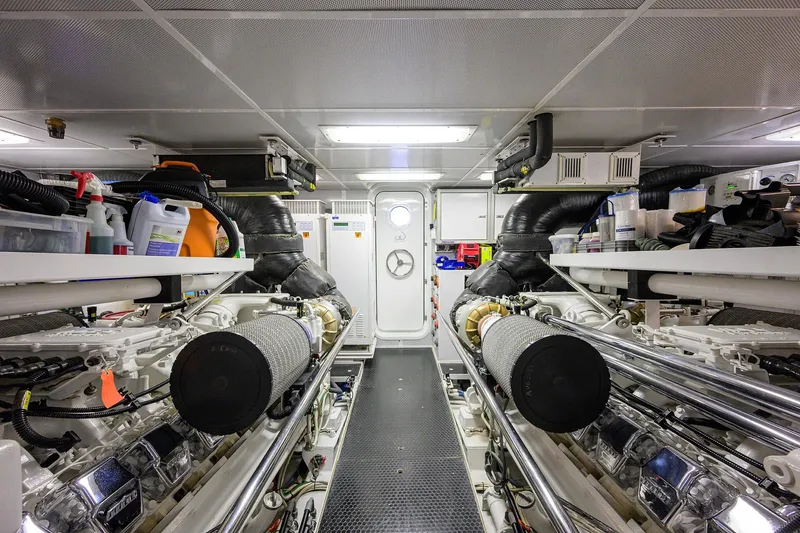 Remy Roo Yacht Photos Pics Engine room of 2014 Westport 112 yacht, featuring dual engines and maintenance equipment.