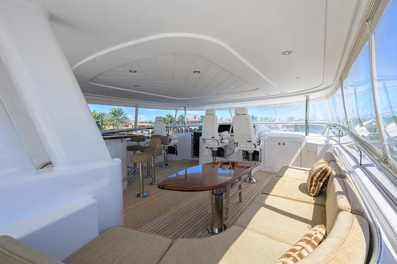 Remy Roo Yacht Photos Pics Luxurious interior of 2014 Westport 112 yacht with elegant seating and helm chairs.