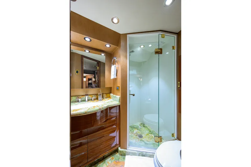 Remy Roo Yacht Photos Pics Luxurious bathroom in 2014 Westport 112 yacht with glass shower and elegant vanity.