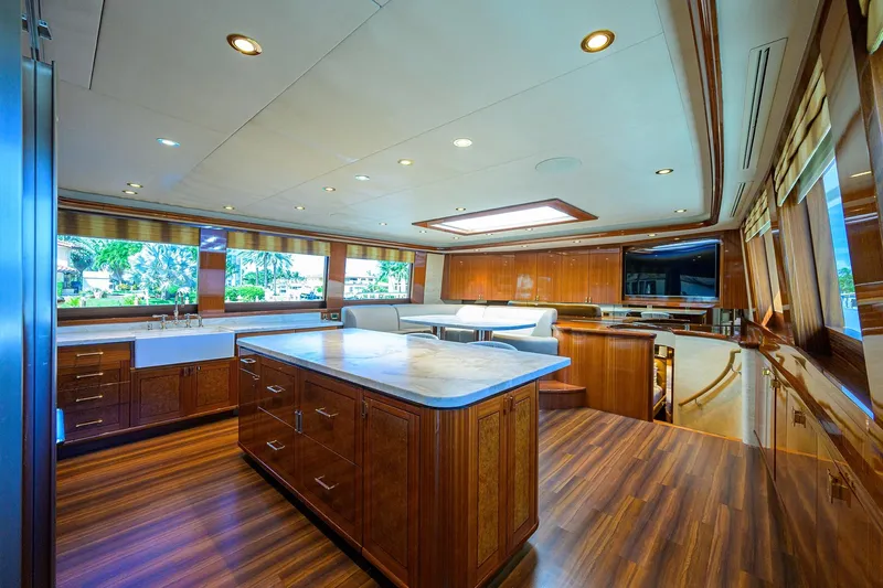 Remy Roo Yacht Photos Pics Luxurious interior of 2014 Westport 112 yacht with elegant wood finishes and modern amenities.