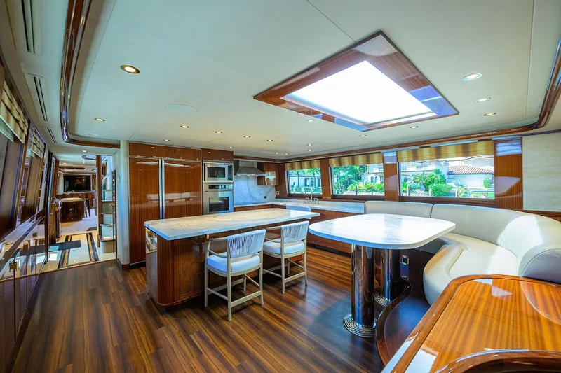 Remy Roo Yacht Photos Pics Luxurious interior of 2014 Westport 112 yacht with modern kitchen and dining area.