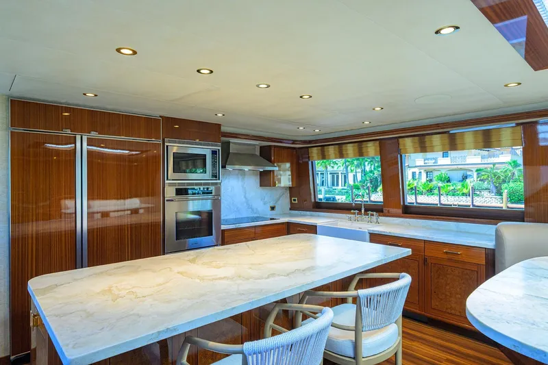 Remy Roo Yacht Photos Pics Luxurious kitchen interior on 2014 Westport 112 yacht with marble countertops and modern appliances.