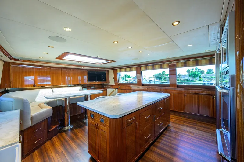 Remy Roo Yacht Photos Pics Luxurious interior of 2014 Westport 112 yacht with elegant wood finishes and modern amenities.
