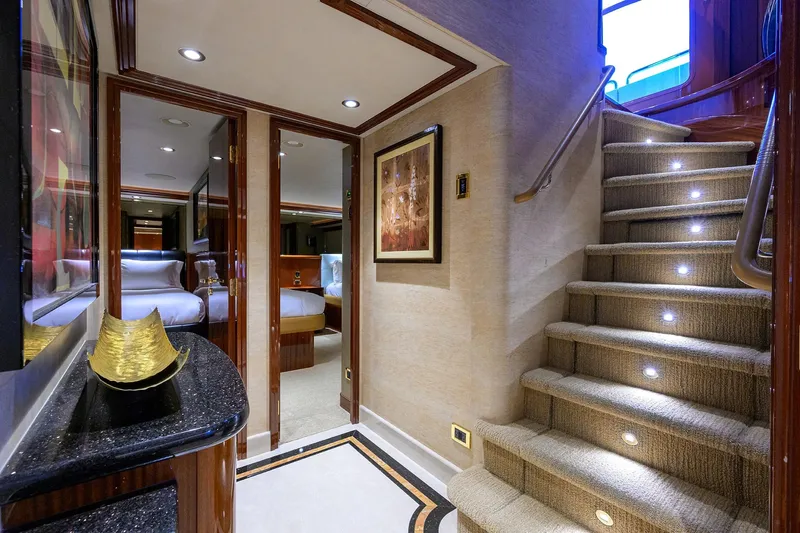 Remy Roo Yacht Photos Pics Luxurious interior of 2014 Westport 112 yacht with elegant staircase and modern decor.