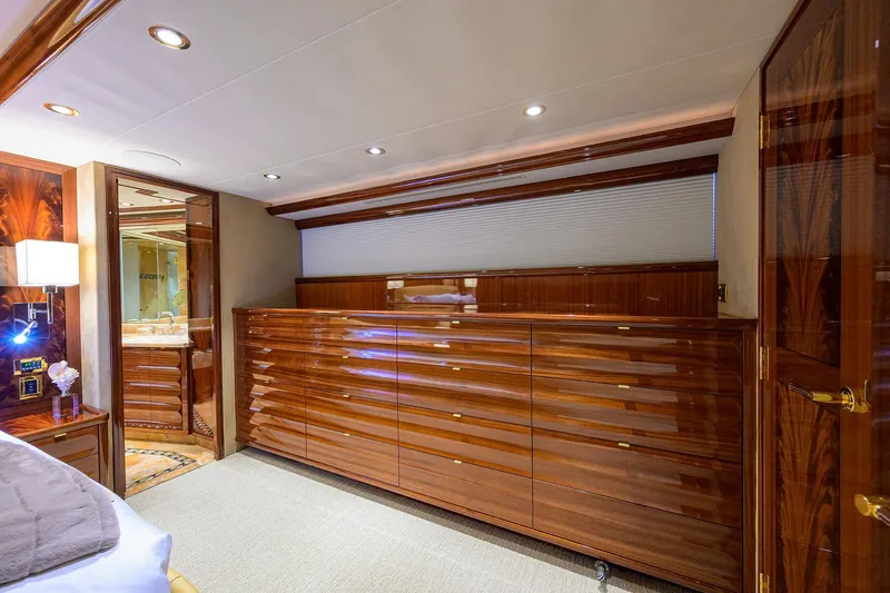 Remy Roo Yacht Photos Pics Luxurious interior of 2014 Westport 112 yacht with polished wood cabinetry and elegant lighting.