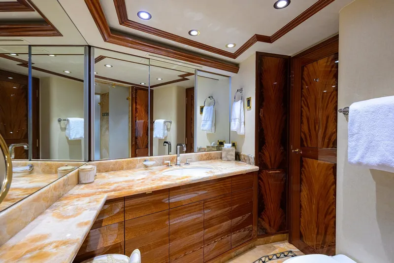 Remy Roo Yacht Photos Pics Luxurious bathroom interior on 2014 Westport 112 yacht, featuring elegant wood finishes and marble countertops.