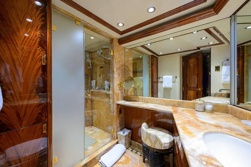 Remy Roo Yacht Photos Pics Luxurious bathroom in 2014 Westport 112 yacht with marble countertops and elegant wood finishes.