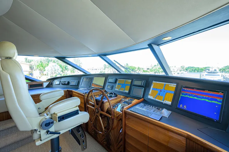 Remy Roo Yacht Photos Pics Luxurious 2014 Westport 112 yacht cockpit with advanced navigation systems and plush captain's chair.