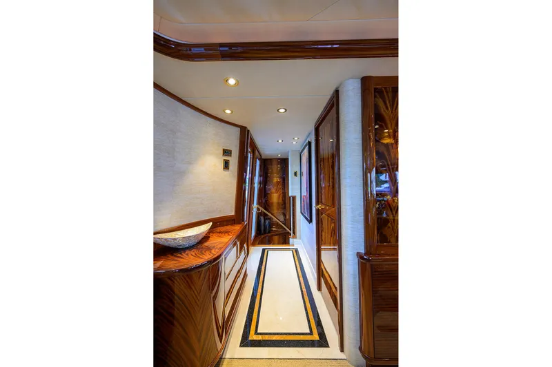 Remy Roo Yacht Photos Pics Luxurious hallway interior of 2014 Westport 112 yacht with elegant wood finishes.