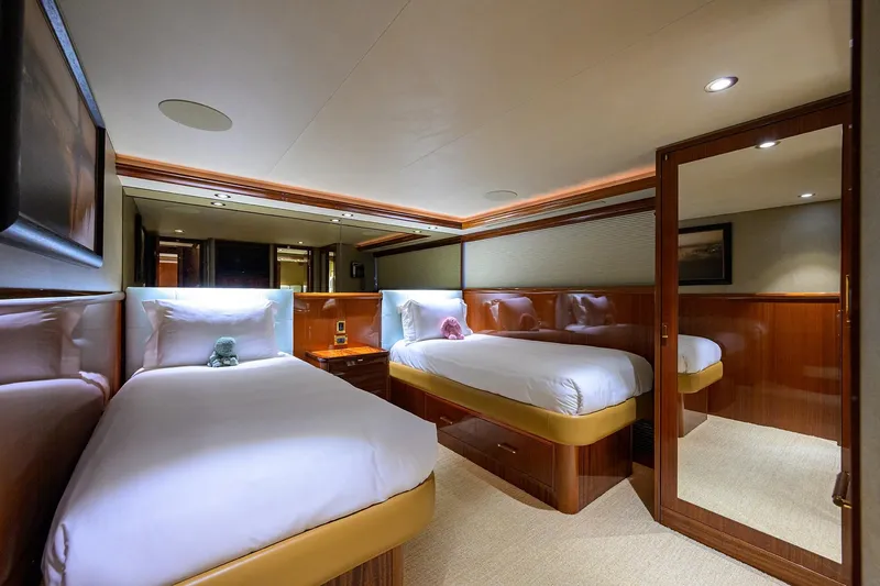 Remy Roo Yacht Photos Pics Luxurious twin cabin interior of 2014 Westport 112 yacht with elegant wood finishes.