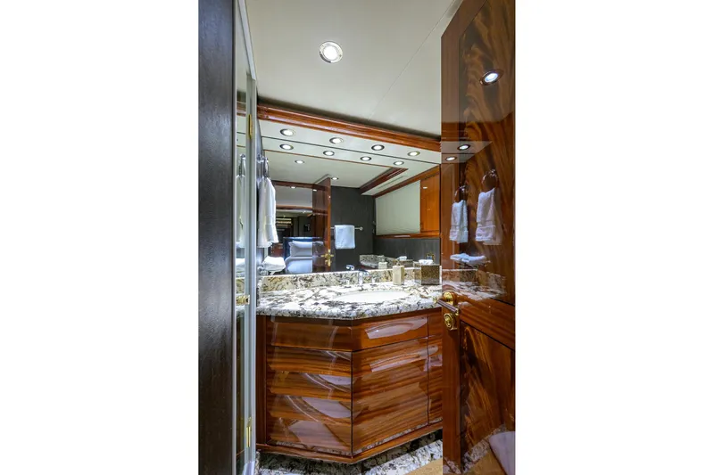 Remy Roo Yacht Photos Pics Luxurious bathroom interior on 2014 Westport 112 yacht with marble countertop and wood finishes.