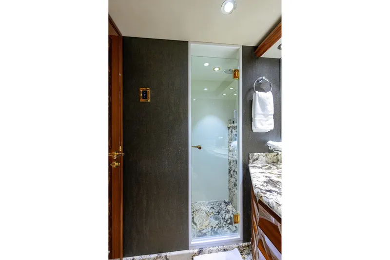 Remy Roo Yacht Photos Pics Luxurious bathroom in 2014 Westport 112 yacht with marble accents and glass shower.