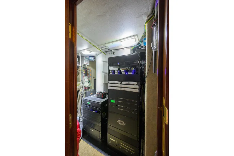 Remy Roo Yacht Photos Pics Electrical equipment room inside a 2014 Westport 112 yacht, featuring various control panels.