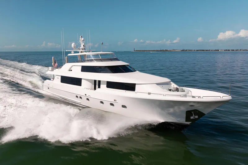 Remy Roo Yacht Photos Pics Luxurious 2014 Westport 112 yacht cruising on open water under clear skies.