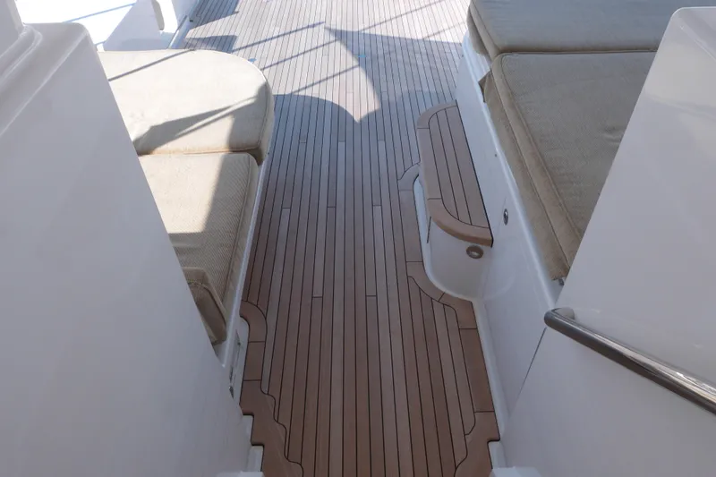 Remy Roo Yacht Photos Pics Luxurious teak deck and seating on 2014 Westport 112 yacht.