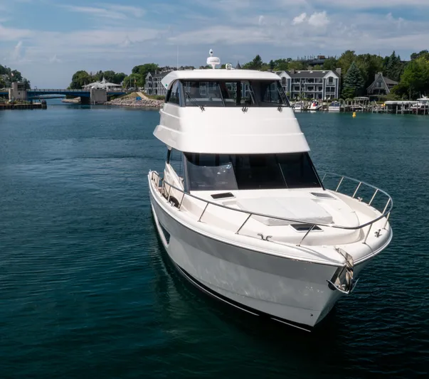 One More Yacht Photos Pics 2024 Maritimo M55 yacht cruising in a scenic harbor setting.