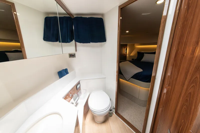 One More Yacht Photos Pics Luxurious bathroom and bedroom interior of 2024 Maritimo M55 yacht.