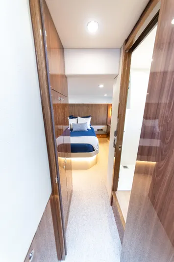 One More Yacht Photos Pics Luxurious cabin interior of 2024 Maritimo M55 yacht with modern design and cozy bedding.