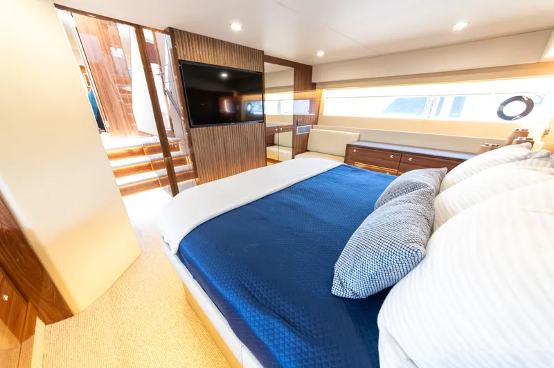 One More Yacht Photos Pics Luxurious interior of 2024 Maritimo M55 yacht with elegant bedroom and modern amenities.