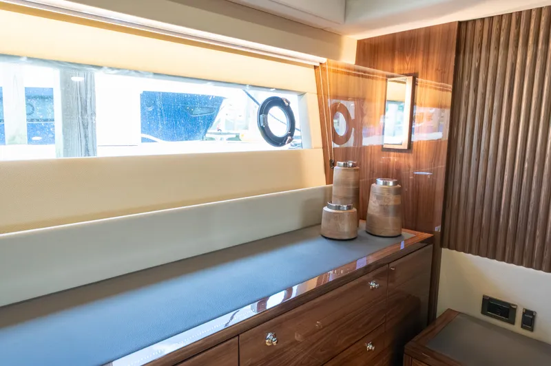 One More Yacht Photos Pics Luxurious interior of 2024 Maritimo M55 yacht with elegant wood finishes and modern decor.
