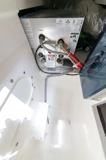 One More Yacht Photos Pics Engine compartment of 2024 Maritimo M55 yacht, showcasing mechanical components and wiring.