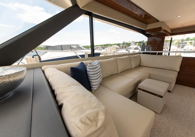 One More Yacht Photos Pics Luxurious interior of 2024 Maritimo M55 yacht with cream leather seating and scenic marina view.