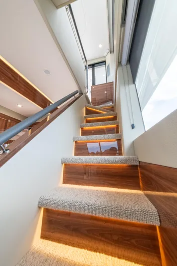 One More Yacht Photos Pics Staircase with ambient lighting in 2024 Maritimo M55 yacht interior.