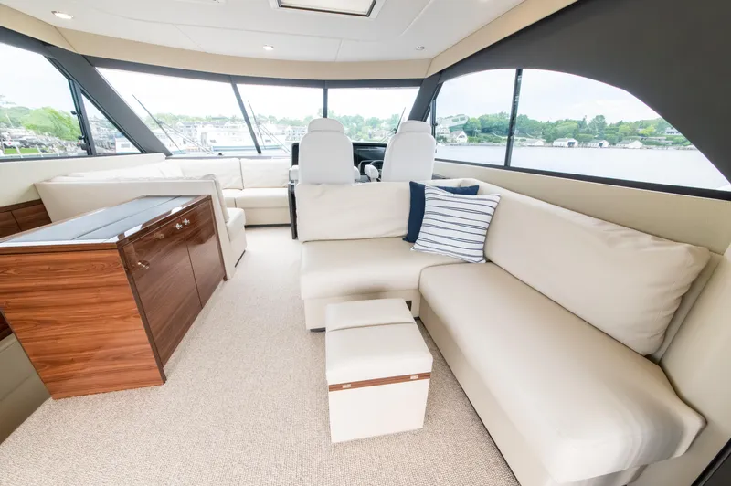 One More Yacht Photos Pics Luxurious interior of 2024 Maritimo M55 yacht with plush seating and panoramic windows.
