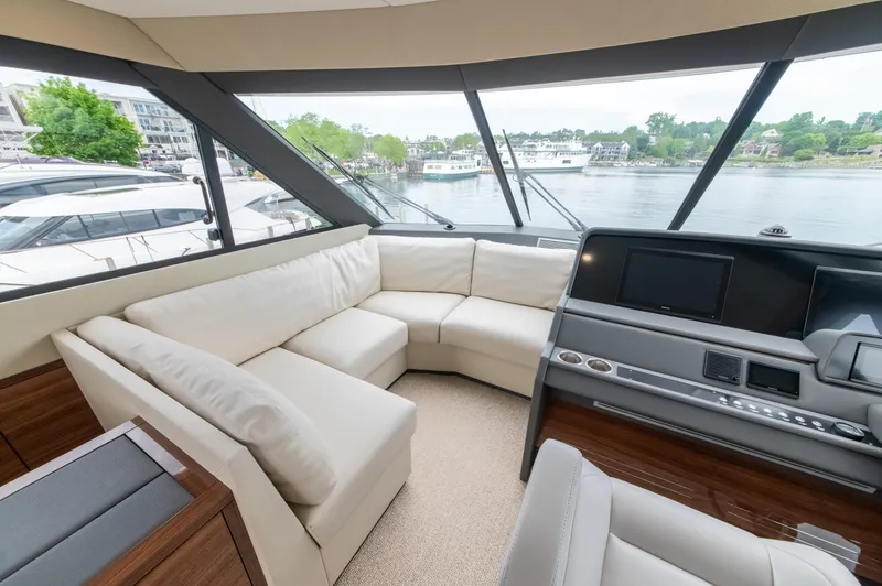 One More Yacht Photos Pics Luxurious interior of 2024 Maritimo M55 yacht with plush seating and panoramic windows.