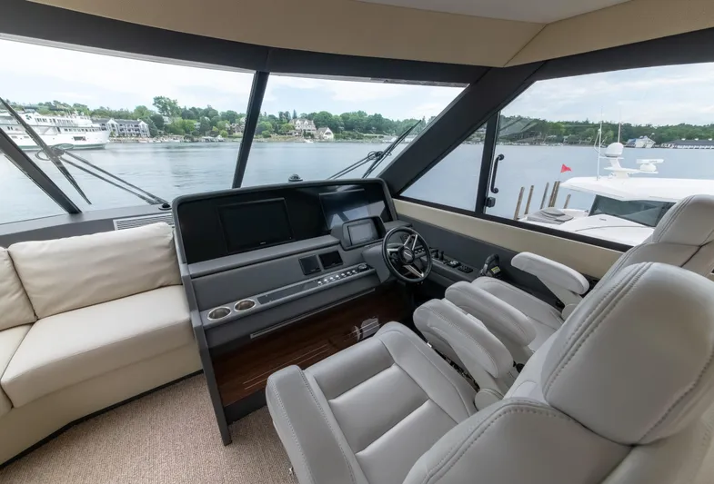 One More Yacht Photos Pics Luxurious interior of 2024 Maritimo M55 yacht with modern helm and panoramic windows.