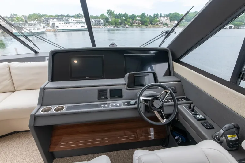 One More Yacht Photos Pics 2024 Maritimo M55 yacht helm with modern controls and panoramic view.