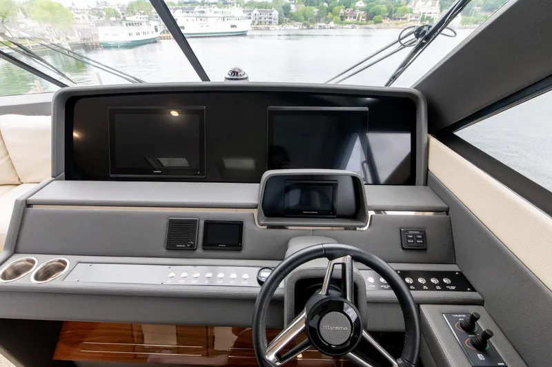 One More Yacht Photos Pics 2024 Maritimo M55 yacht helm with modern navigation displays and controls.