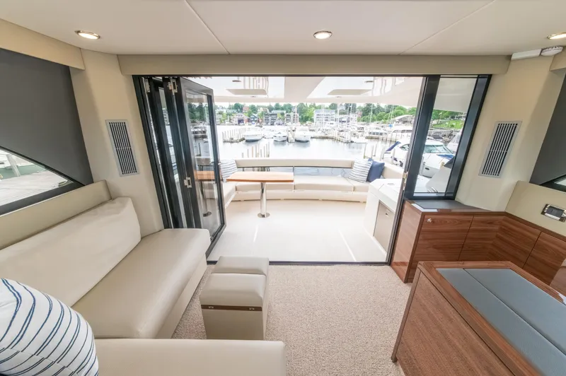 One More Yacht Photos Pics Luxurious interior of 2024 Maritimo M55 yacht with marina view.