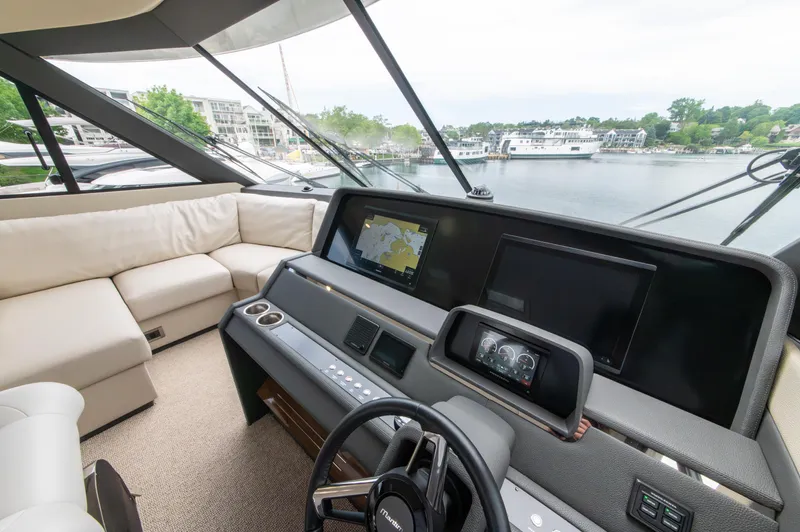 One More Yacht Photos Pics 2024 Maritimo M55 yacht interior with modern helm and navigation screens.