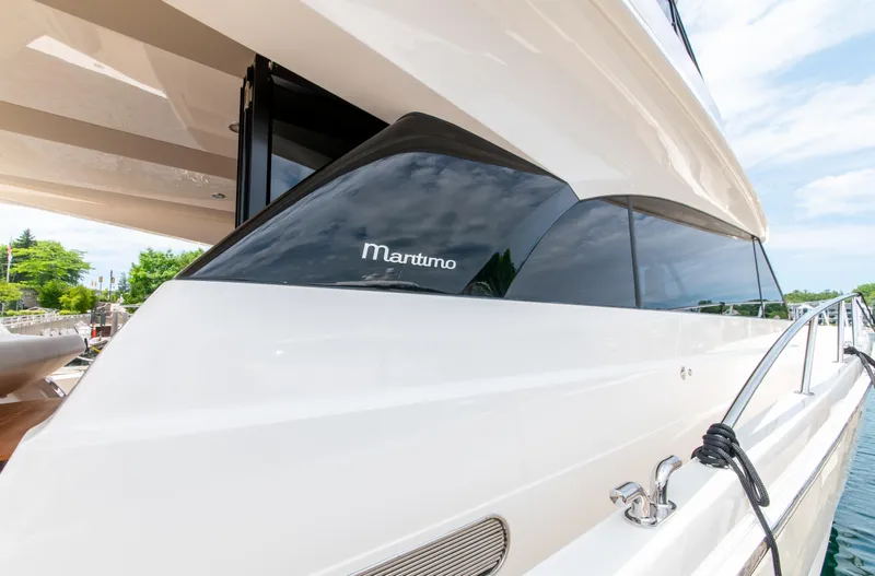 One More Yacht Photos Pics 2024 Maritimo M55 yacht, sleek design, docked with clear skies.