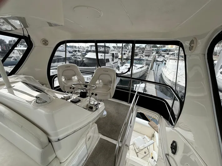  Yacht Photos Pics Interior view of 2004 Silverton 38 Convertible yacht with marina backdrop.