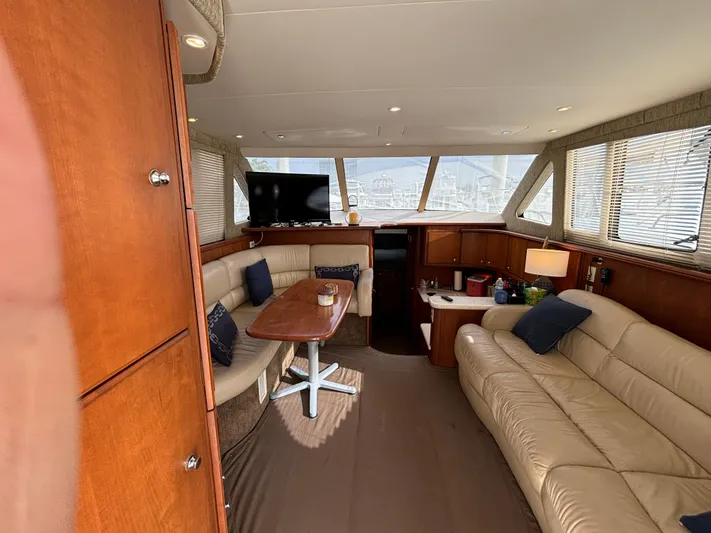  Yacht Photos Pics Interior of 2004 Silverton 38 Convertible yacht with leather seating and wooden accents.