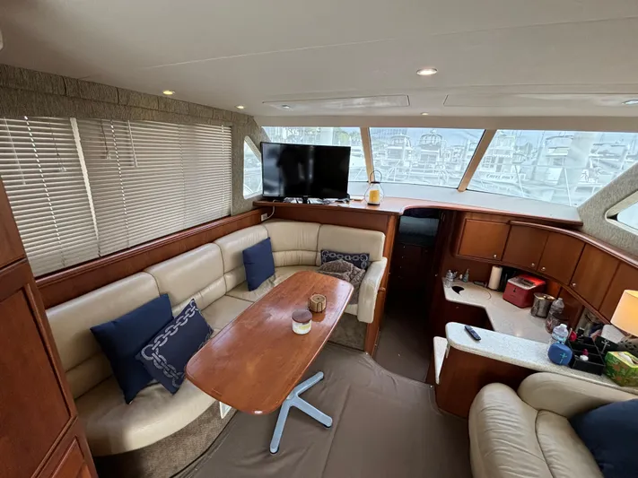  Yacht Photos Pics Interior of 2004 Silverton 38 Convertible yacht with cozy seating and modern amenities.