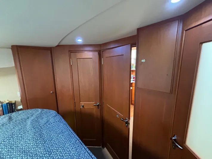  Yacht Photos Pics Interior of 2004 Silverton 38 Convertible yacht with wooden doors and cozy cabin.