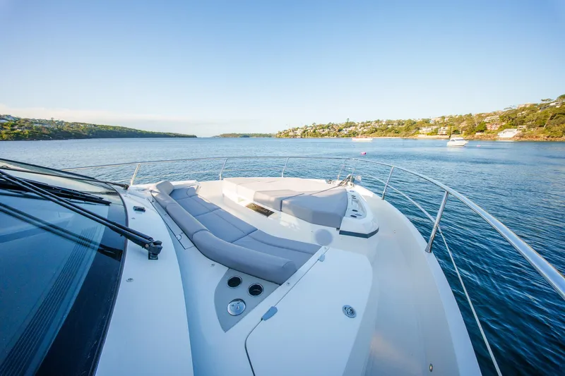 2023 Pearl 62 Luxury Yacht Yacht Photos Pics Luxurious 2023 Pearl 62 yacht cruising on serene blue waters.