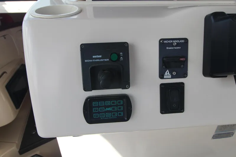 Karma Sea's Yacht Photos Pics Control panel of a 2001 Grady-White Express 330 boat with various switches and buttons.