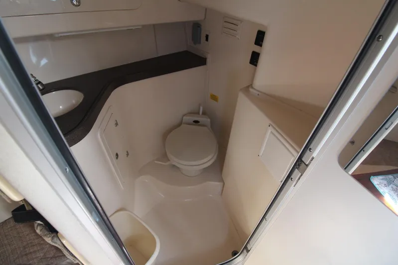 Karma Sea's Yacht Photos Pics 2001 Grady-White Express 330 boat bathroom with toilet and sink.