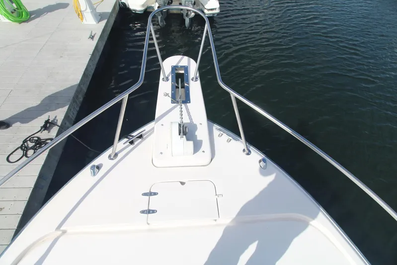 Karma Sea's Yacht Photos Pics Bow view of 2001 Grady-White Express 330 boat docked at marina.