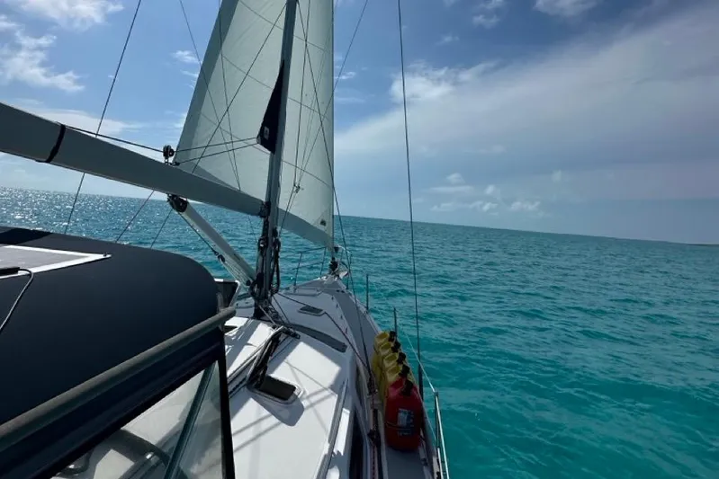 Free Range Yacht Photos Pics Sailing on a 2005 Hunter 44 yacht in clear blue ocean waters.