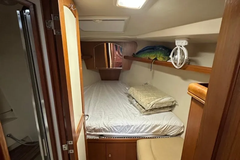 Free Range Yacht Photos Pics Cozy cabin interior of 2005 Hunter 44 sailboat with bed and storage.