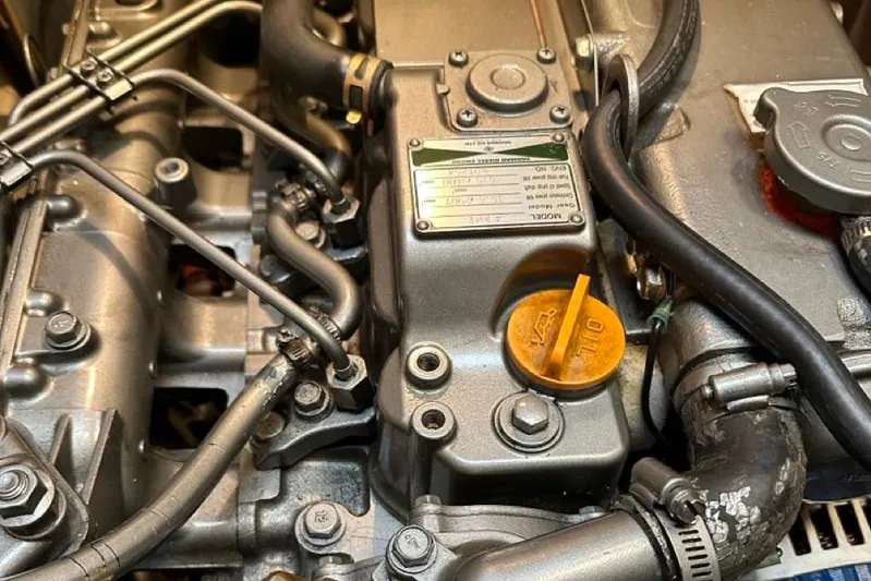 Free Range Yacht Photos Pics Close-up of a 2005 Hunter 44 engine with visible components and labels.