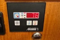 Free Range Yacht Photos Pics Control panel on a 2005 Hunter 44 boat displaying temperature settings.